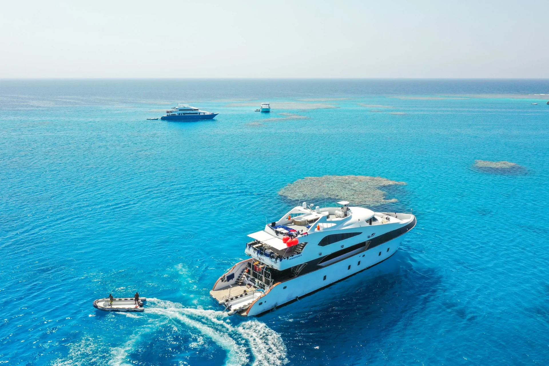 The yacht seen from above in turquoise water
